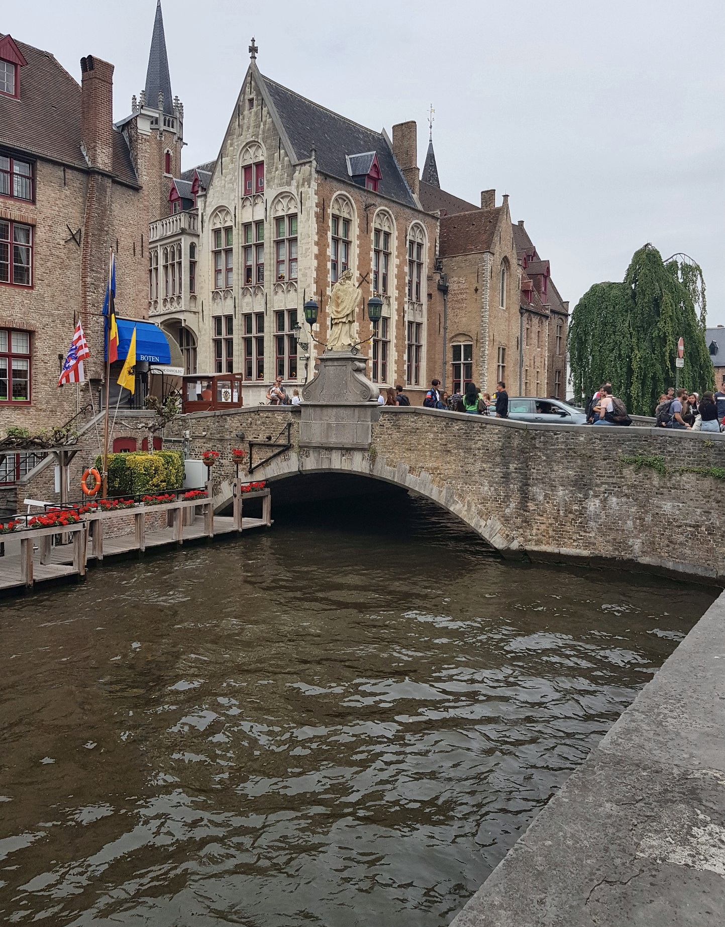 Canal and historic stone bridge in Bruges