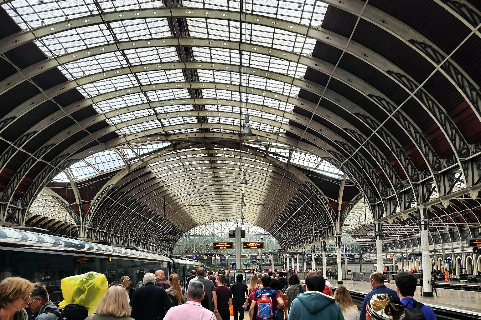 Passengers beneath the great roof of London Paddington