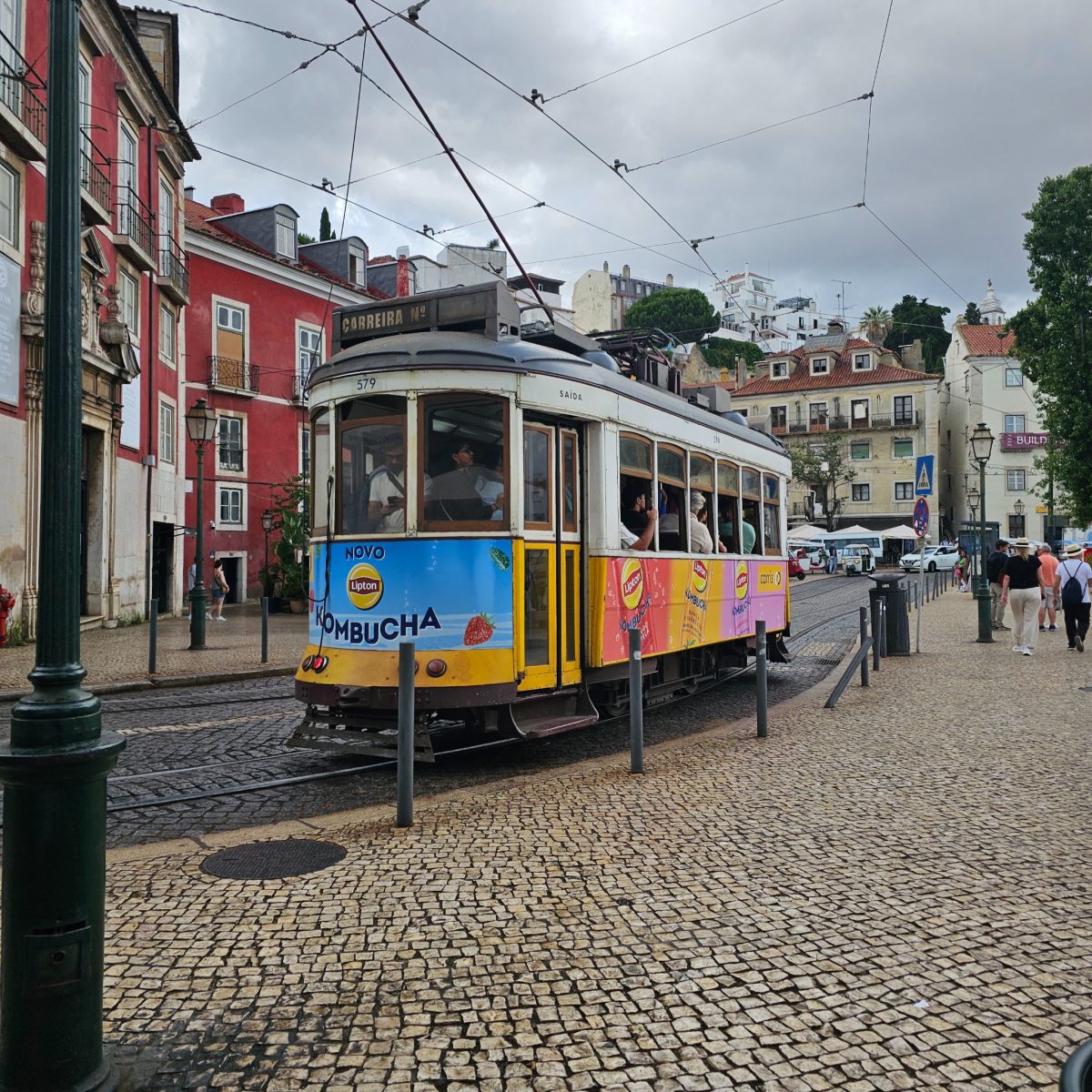 Historic yellow tram 579 on a Lisbon street