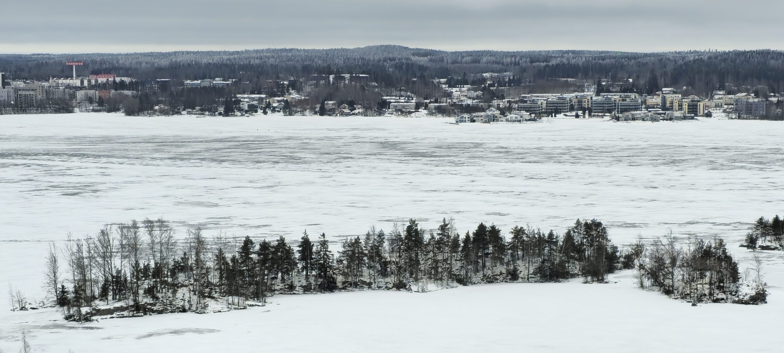 Wide view over a frozen lake from the Pyynikki ridge in Tampere