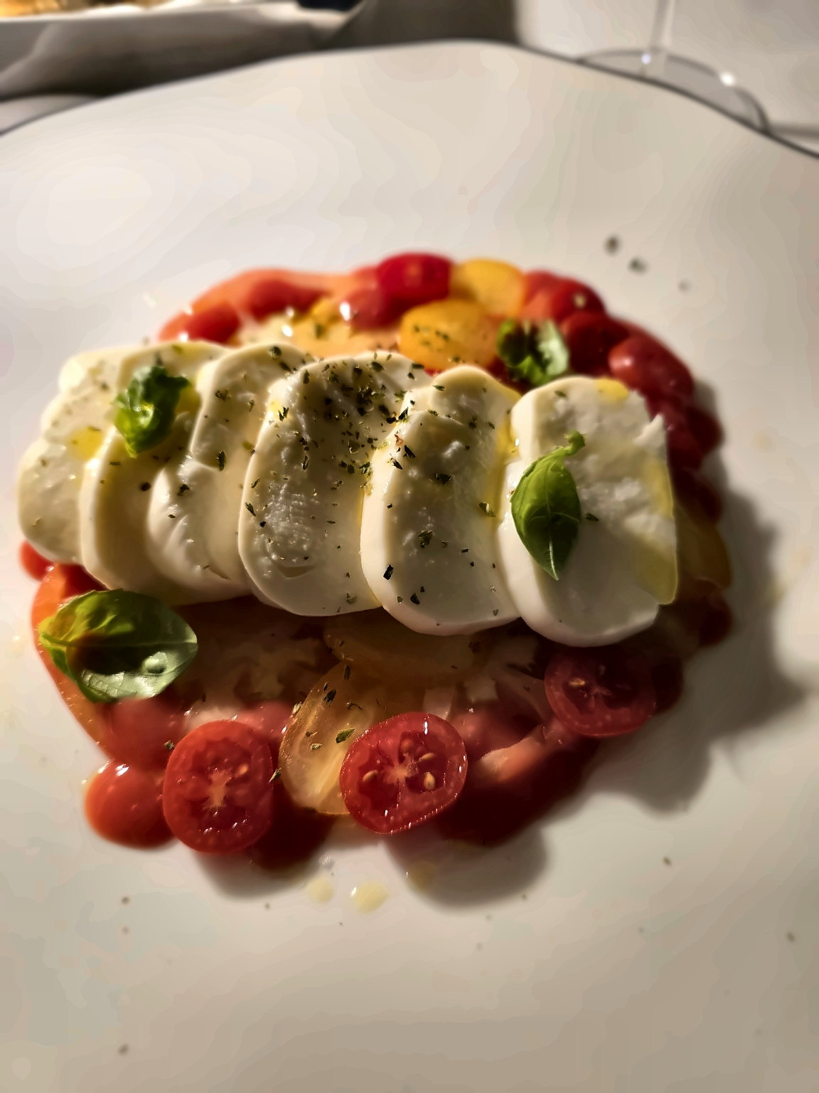 Caprese with mozzarella, tomatoes, basil and olive oil at Campanella by Quattro Passi