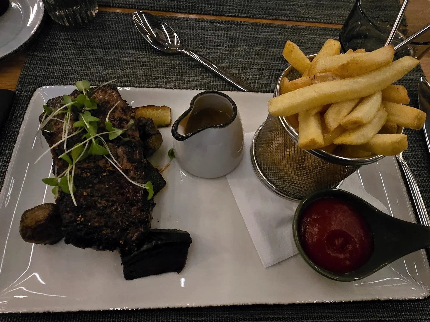 Steak with fries and sauces at Courtyard by Marriott Tampere City