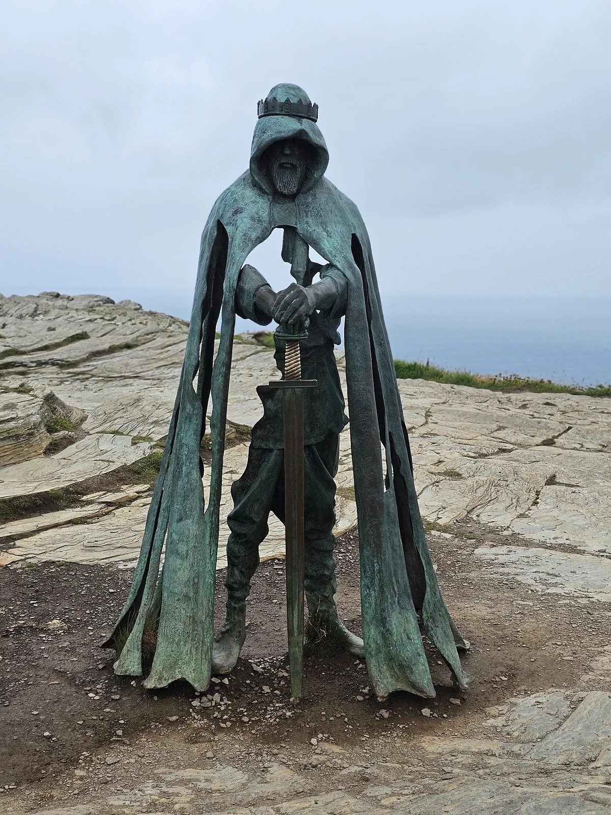 Gallos bronze sculpture overlooking the sea at Tintagel in Cornwall