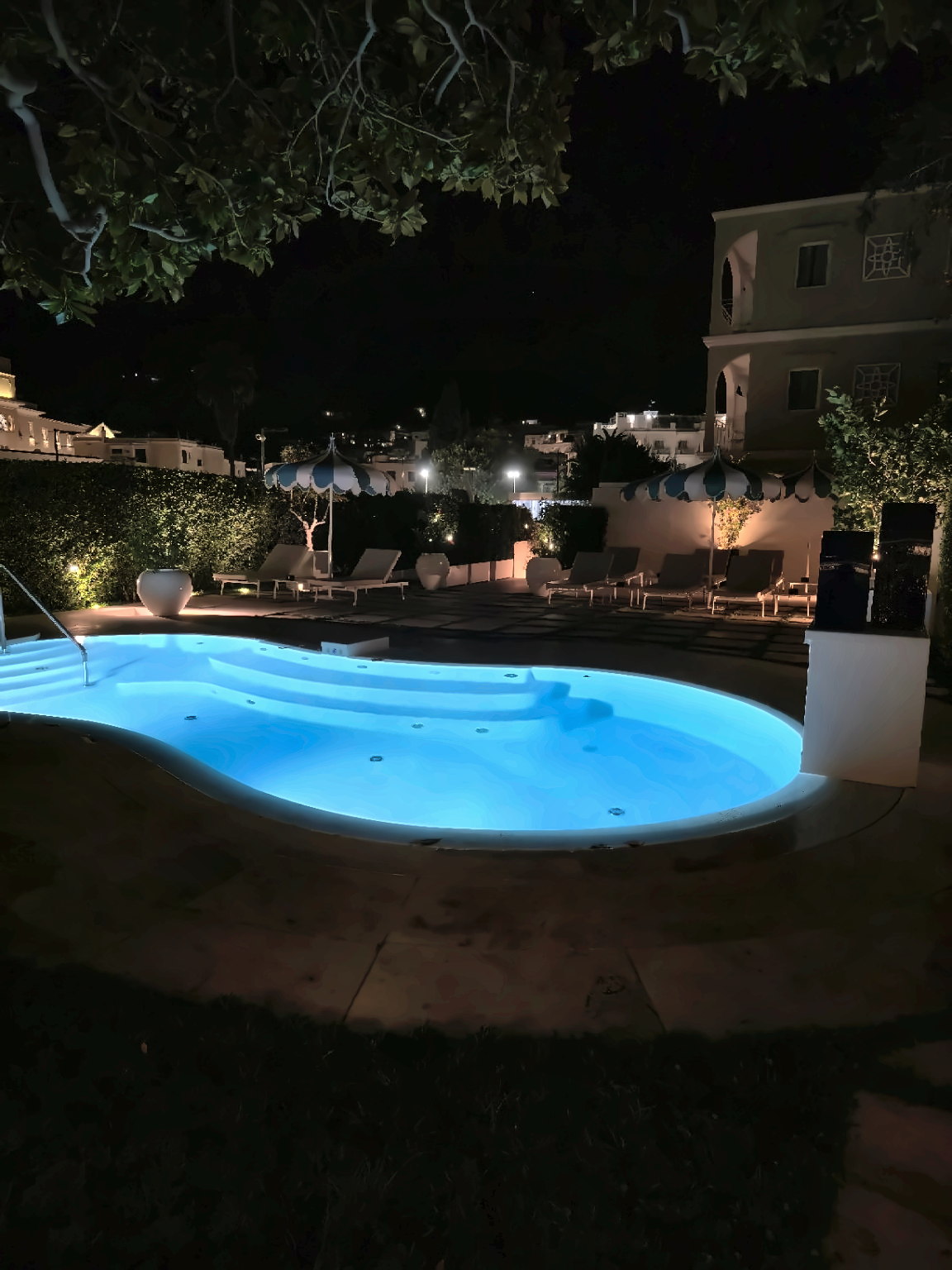 The illuminated pool at Pazziella Capri at night