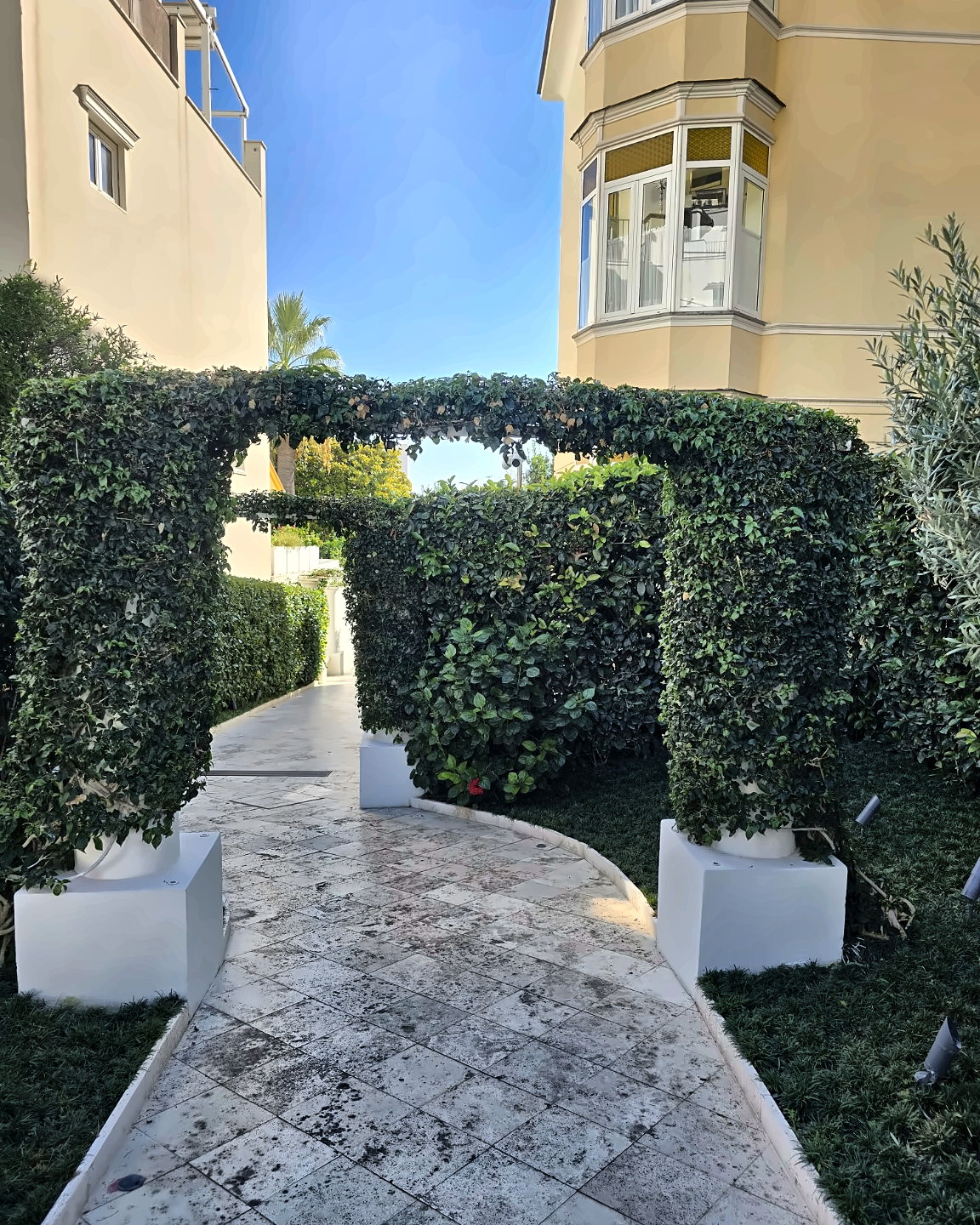 A green garden passage inside Pazziella Capri