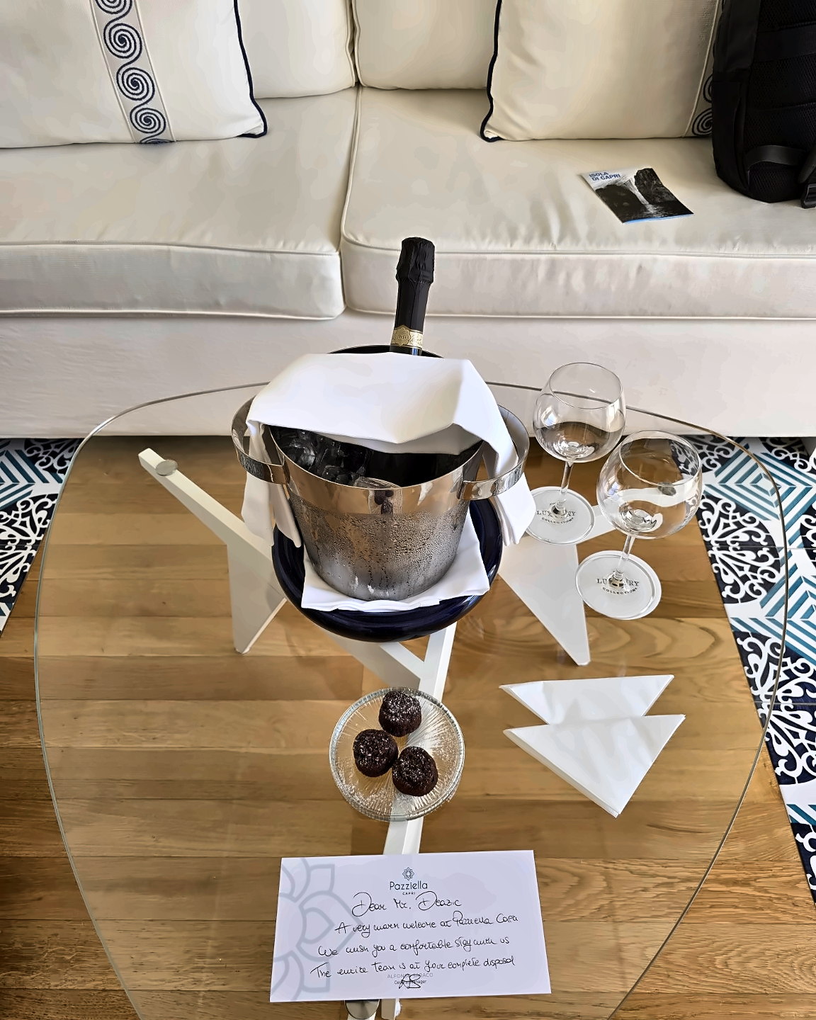 Prosecco, glasses, sweet treats and a welcome note at Pazziella Capri