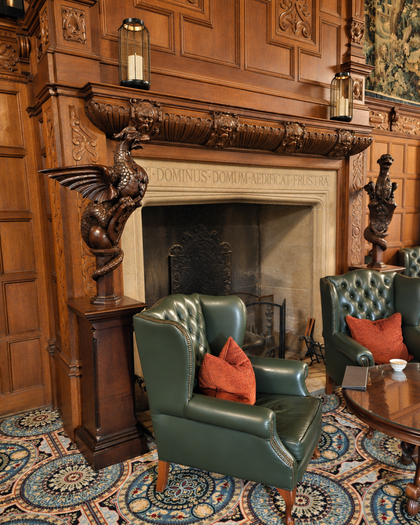 Leather armchairs and fireplace in a lounge at Hanbury Manor