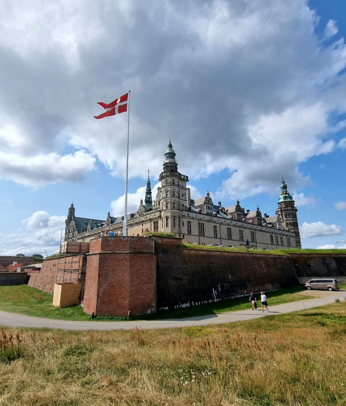 Kronborg Castle in Helsingør with the Danish flag flying above the Renaissance fortress.