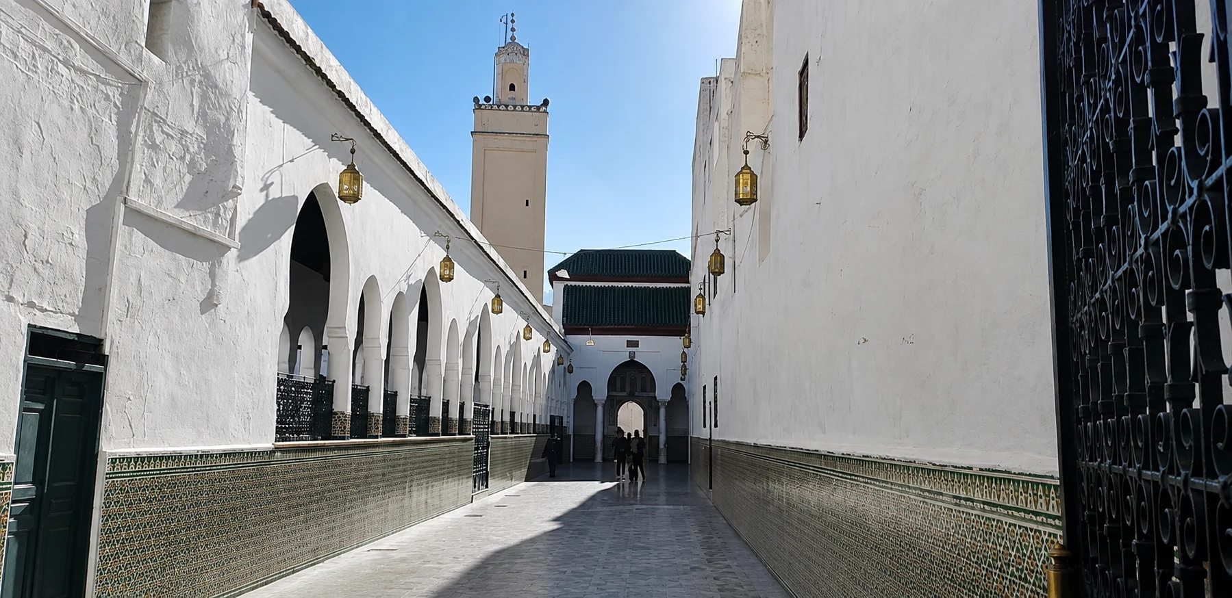 White-walled entrance courtyard to the sanctuary of Idris I in Moulay Idriss.