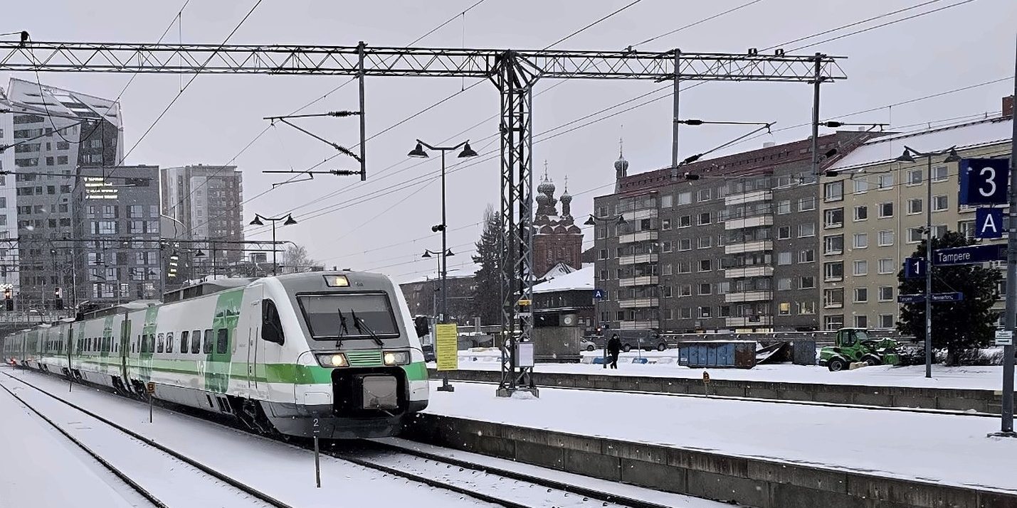 Train arriving at snowy Tampere railway station